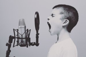 Kid Singing into Microphone