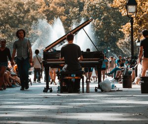 Man Playing Piano in Street